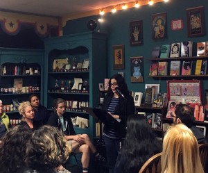 A photo of Alana Saltz giving a talk at a bookstore
